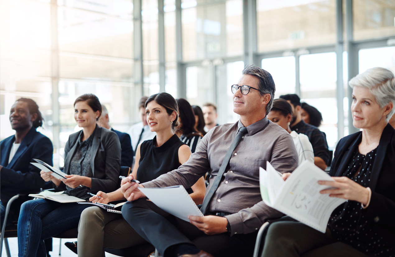 Business Audience listening to speaker